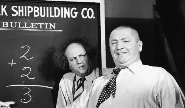 The Three Stooges (Moe, Larry, and Curly) in a classic pose.